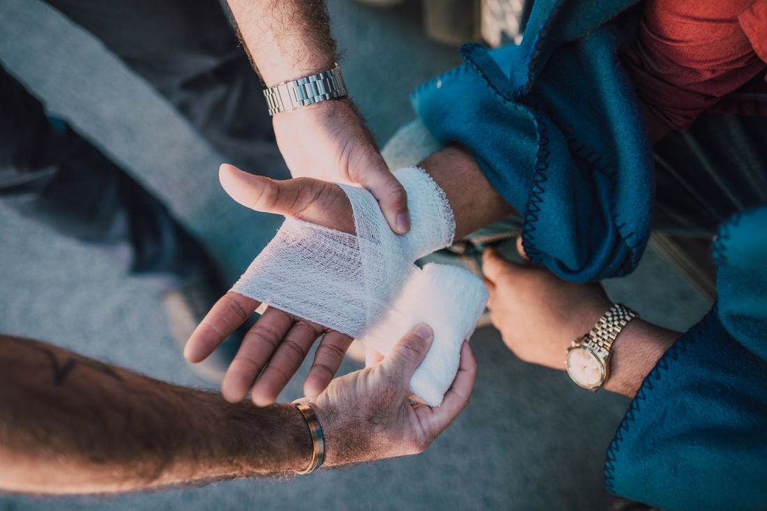A hand being wrapped with a bandage